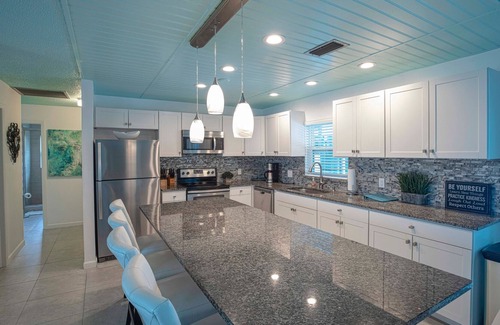Naples Park House | Heated salted pool, outdoor family room, walk to the beach!