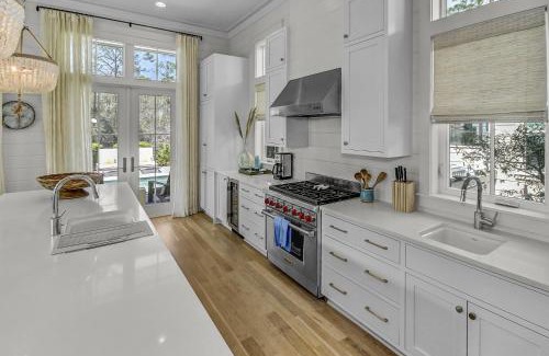 Watercolor House | 'Here Comes the Sun' has a Private Pool, 6 Seat Golf Cart, and Stunning Outdoor Living Space home
