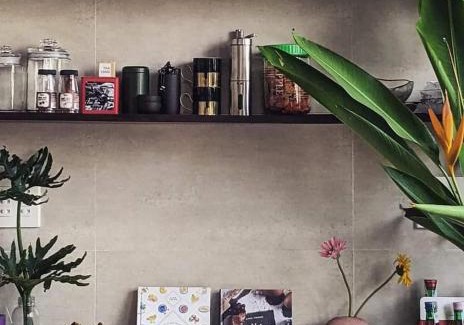 Can Tho House | Here Library - A wooden home by the river with a library