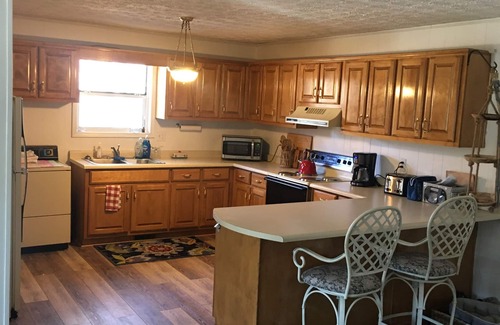 Hiawassee House | Hiawassee Rapids Lodge 4/4 with a hot tub overlooking the river rapids