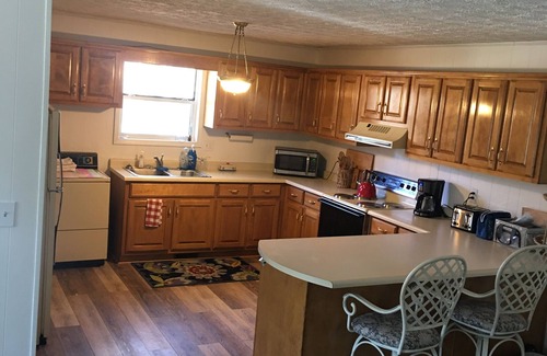 Hiawassee House | Hiawassee Rapids Lodge 4/4 with a hot tub overlooking the river rapids