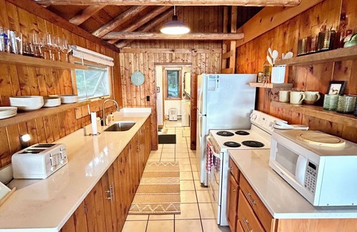 Traverse City Cottage | Hidden Gem Traverse City Lake House with Private Frontage & Sunset Views, Kayaks