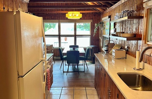 Traverse City Cottage | Hidden Gem Traverse City Lake House with Private Frontage & Sunset Views, Kayaks