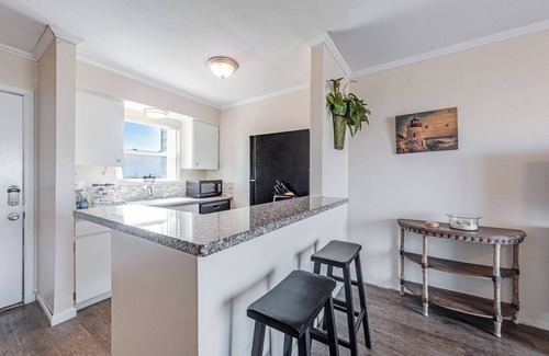 Port Aransas Condo | Hidden in the heart of Port A! Steps away from the pool & fishing pier