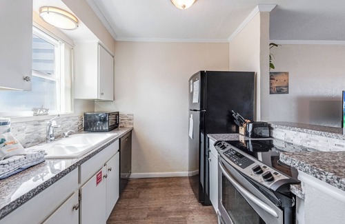 Port Aransas Condo | Hidden in the heart of Port A! Steps away from the pool & fishing pier