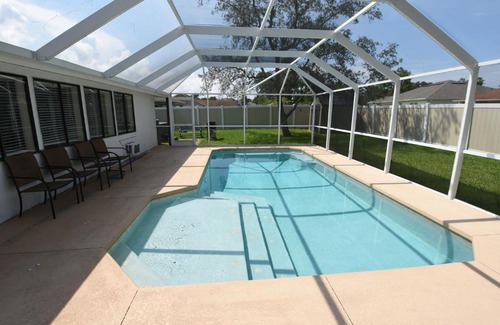 Palm Harbor House | HIDDEN OASIS Spacious Pool Home with Florida Room and Hot Tub