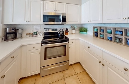 Panama City Beach Condo | High-end Villa Luna at Shores of Panama with pools, hot tubs, & balcony