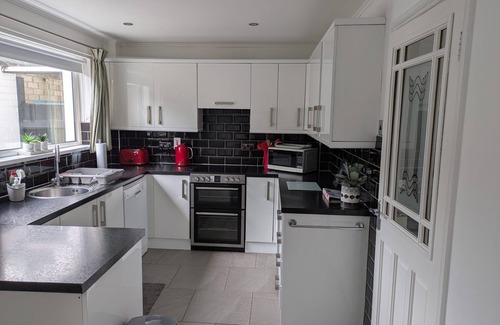 Hillsborough House | Hillsborough spacious house, garden & parking by StayByNumbers