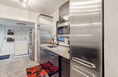 Poinciana Park House | Historic charmer with mini golf course, sauna, Ping-Pong, & wood fireplace