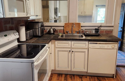 Parkside Apartment | Historic first floor apartment on beautiful Daffin Park, 30-day minimum lease.