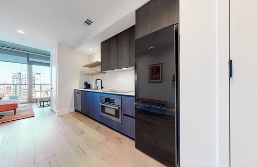 Rainey Street Historic District Apartment | Historic Rainey Street condo with city views, balcony, WiFi, and rooftop pool