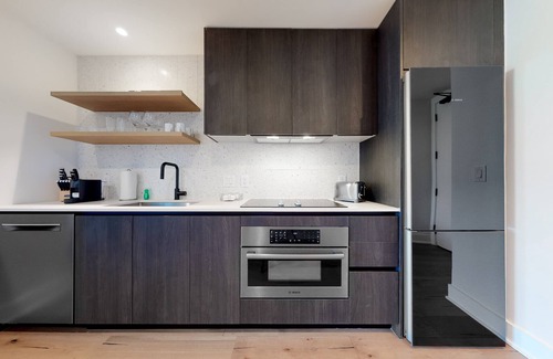 Rainey Street Historic District Apartment | Historic Rainey Street condo with city views, balcony, WiFi, and rooftop pool