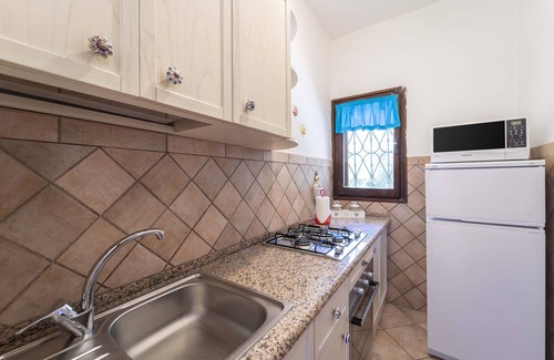 Stintino Apartment | Holiday Apartment "Stintino Sea Front Apartments A" with Sea View and Shared Garden