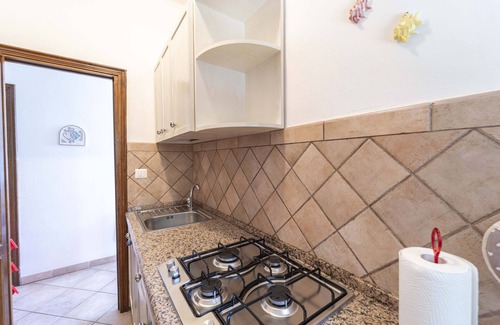 Stintino Apartment | Holiday Apartment "Stintino Sea Front Apartments A" with Sea View and Shared Garden
