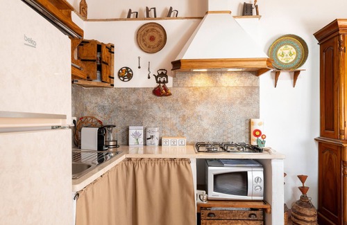 Baunei House | Holiday Home 'Casa Della Nonna Nel Borgo' with Mountain View, Private Garden and Wi-Fi