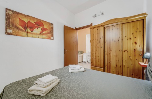 Portoscuso House | Holiday Home 'Casa Di Rita' with Shared Pool, Private Terrace and Air Conditioning