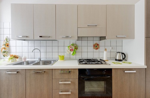 Magomadas House | Holiday Home 'Casa Sole Luna Magomadas' with Private Garden, Balcony and Wi-Fi