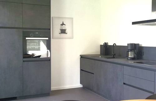Pouch House | Holiday Home 'Schlossterrassen 8b' with Lake View, Private Terrace and Wi-Fi