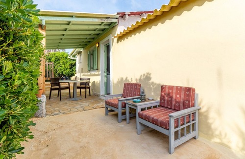 Ag. Georgios House | Holiday Home 'Seafront Studio Stefan' with Sea View, Private Terrace and Air Conditioning