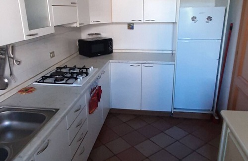 Nettuno House | Holiday Home 'Villetta Indipendente' with Private Terrace, Wi-Fi and Air Conditioning
