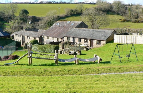 Chillington Apartment | Holiday on a Converted Cider Farm with indoor pool, tennis court and playroom.