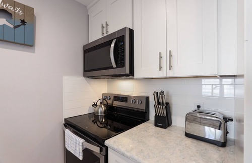 Holmes Beach Cottage | Home with Private Pool, Two Blocks from the Beach! - Queen Palms