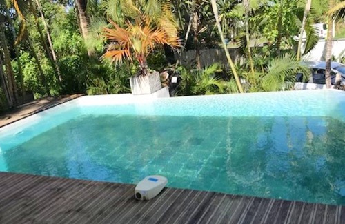 Manapany-les-Bains House | Homerez - House 1 km away from the beach with shared pool, jacuzzi and garden