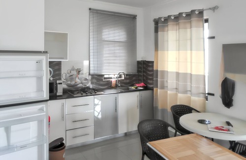 Mont Choisy Apartment | Homerez - Studio in Trou-aux-Biches, garden view.