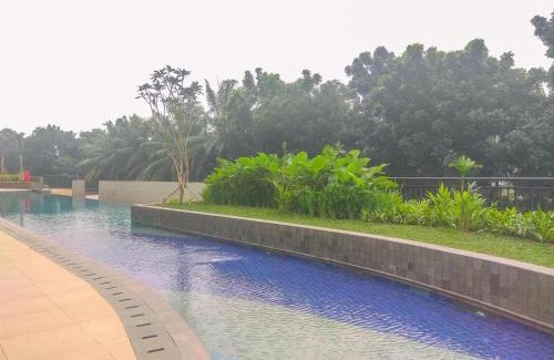 Depok Apartment | Homey and Modern Look 2BR Transpark Cibubur Apartment By Travelio