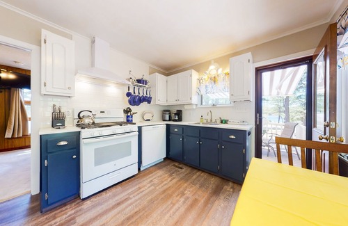 The Bays House | Homey lakeside property w/one house, two cottages, mtn. views, & private beach