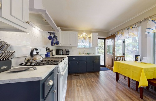 The Bays House | Homey lakeside property w/one house, two cottages, mtn. views, & private beach