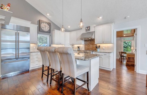 Huddleston House | Hook & Paddle - Luxury home on SML with kayaks and private dock.