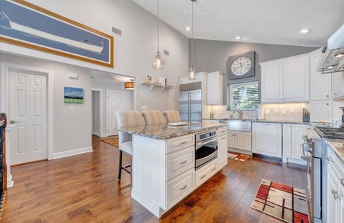 Huddleston House | Hook & Paddle - Luxury home on SML with kayaks and private dock.