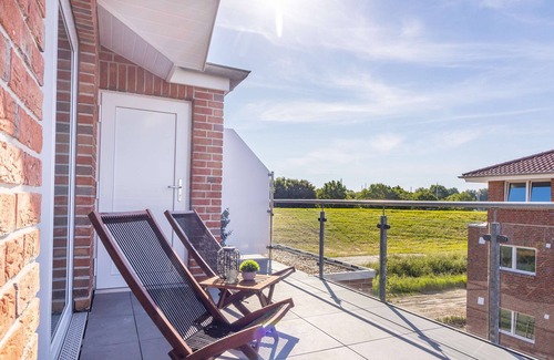 Wangerland Apartment | Hookser Perle: Modern hygge penthouse directly behind the dyke