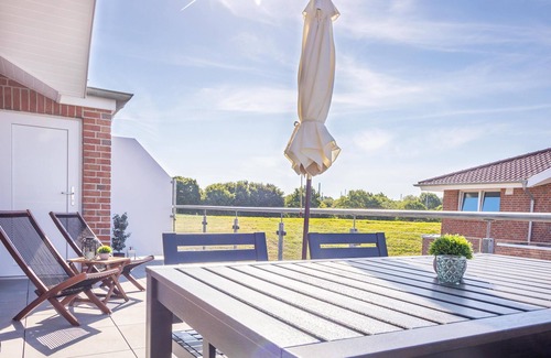 Wangerland Apartment | Hookser Perle: Modern hygge penthouse directly behind the dyke