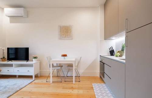 Guimaraes Apartment | HostWise - Bright Flat w/Balcony