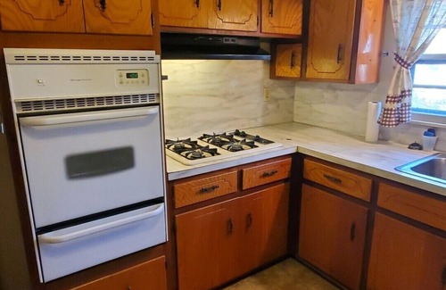 Malvern House | House with a full kitchen big backyard with trees