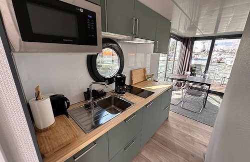 Lundby Boat Rental | Houseboat GREBBESTAD with roof terrace in the heart of Gothenburg