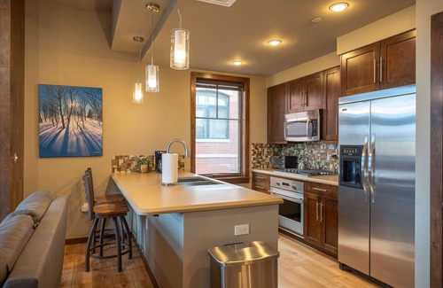 Downtown Steamboat Springs Condo | Howelsen Place A302 | Air Conditioning | Private Parking Garage | Fire Pit with Views