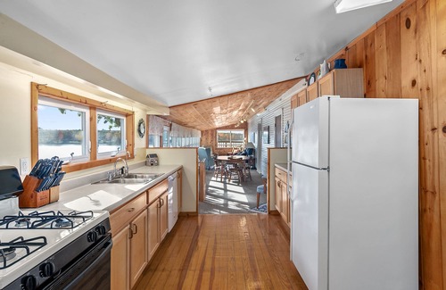 Newaygo House | Huge lake house. 3 levels. 9 bedrooms. Great for groups. Large beach. Fire pit.