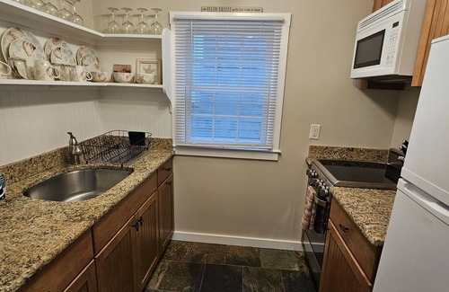 Commercial Street Condo | Ideal 2BR Condo – Steps to Beach & Downtown, Waterfront Deck, Parking Included