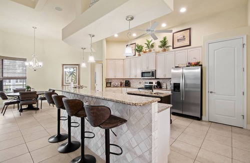 Pelican House | III Palms Oasis - 4/3 Electric Heated Pool & Spa with Gulf Access, Tiki Hut and Boat Dock