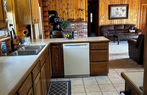 Seeley Lake Cabin | Immaculate log house with backyard view of pond, in Seeley!