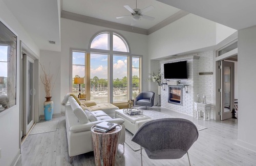 Shelter Cove Villa | Immaculately updated harbor view penthouse condo near beach!