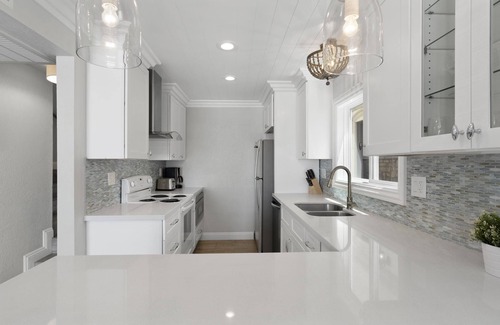 West Newport Condo | Incredible Oceanfront Home | Rooftop Deck | Cool, Coastal Interior!