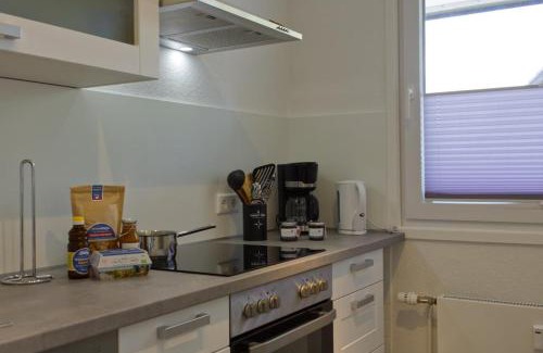 Neue Tiefe House | Inselblume 58 - Ferienwohnung mit Balkon in Neue Tiefe