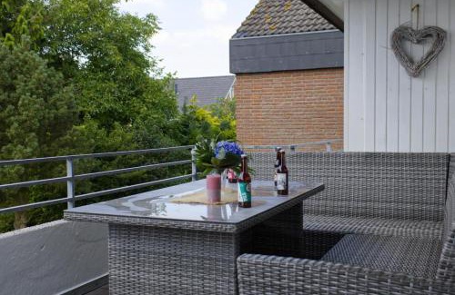 Neue Tiefe House | Inselblume 58 - Ferienwohnung mit Balkon in Neue Tiefe