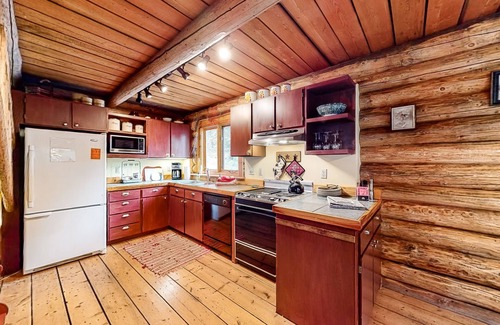 Enterprise Cabin | Inviting cabin with mountain view, fireplace, full kitchen, W/D, & back porch