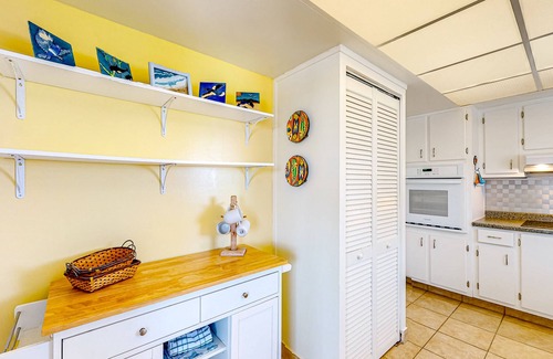 South Patrick Shores Condo | Inviting condo with ocean view, balcony, full kitchen, central AC, & W/D