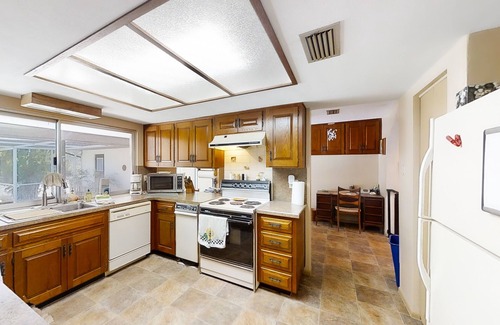 East Lake House | Inviting home with pool, patio, grill, full kitchen, central AC, & W/D